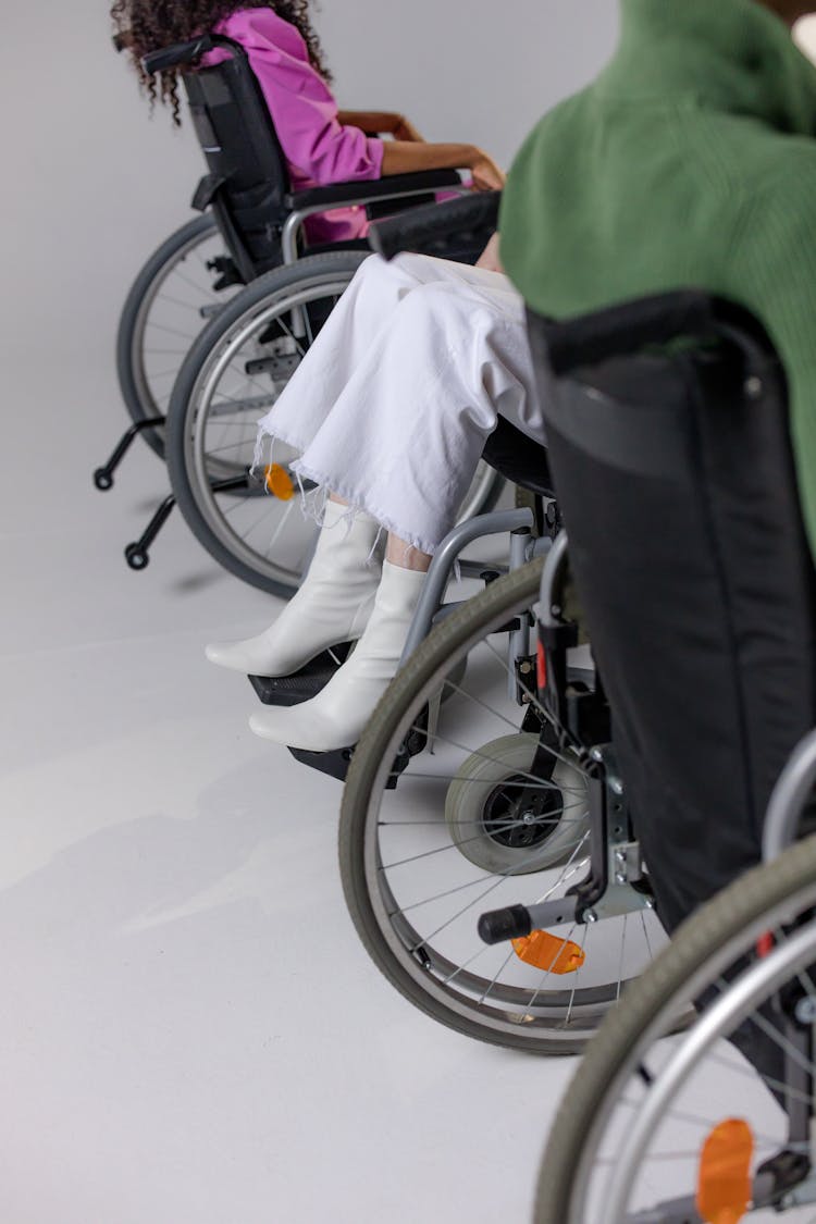 People Sitting On Wheelchairs