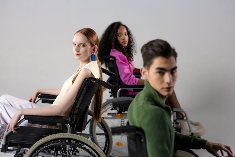 People Sitting On Wheelchairs