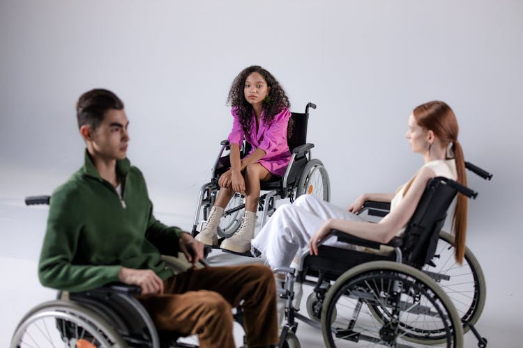 Man And Women On Wheelchairs