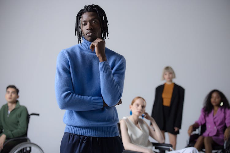 A Man Wearing A Blue Turtle Neck Sweater