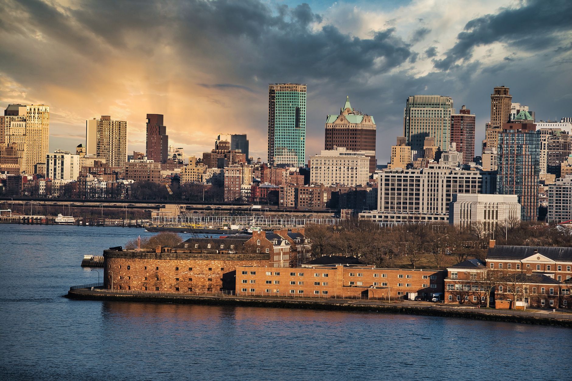 Captivating aerial shot of New York City's skyline at sunset with vibrant clouds.