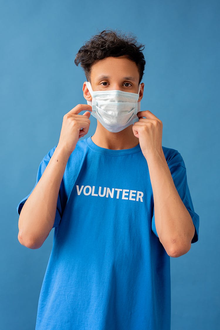 A Volunteer Wearing A Face Mask