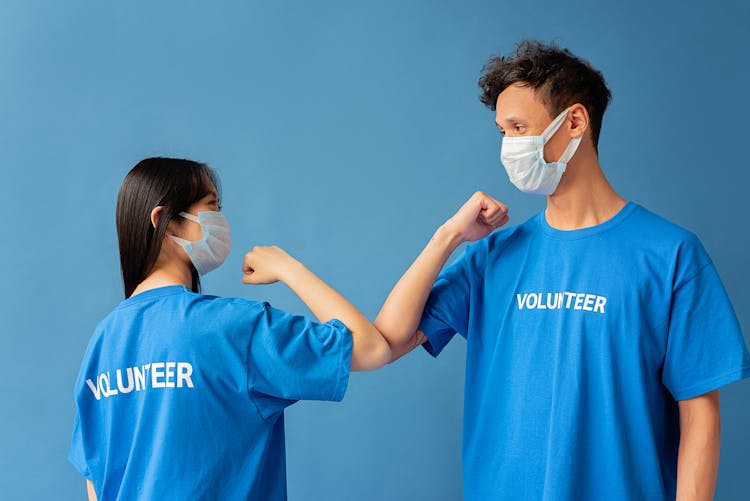 Volunteers Touching Elbows