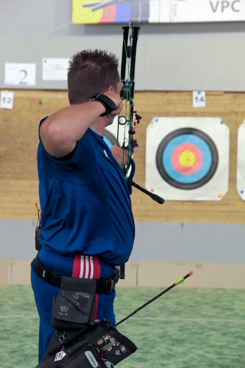 Free A Man Holding a Bow Stock Photo