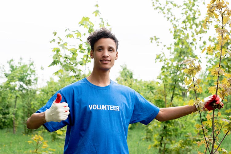 Man Wearing Blue Volunteer Shirt