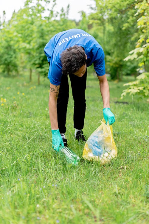 Man Collecting Up Plastic Bottle 