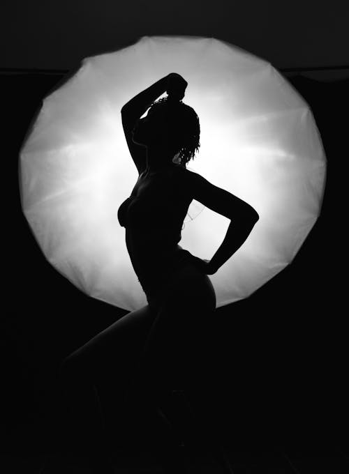 Silhouette of a Woman Posing Seductively