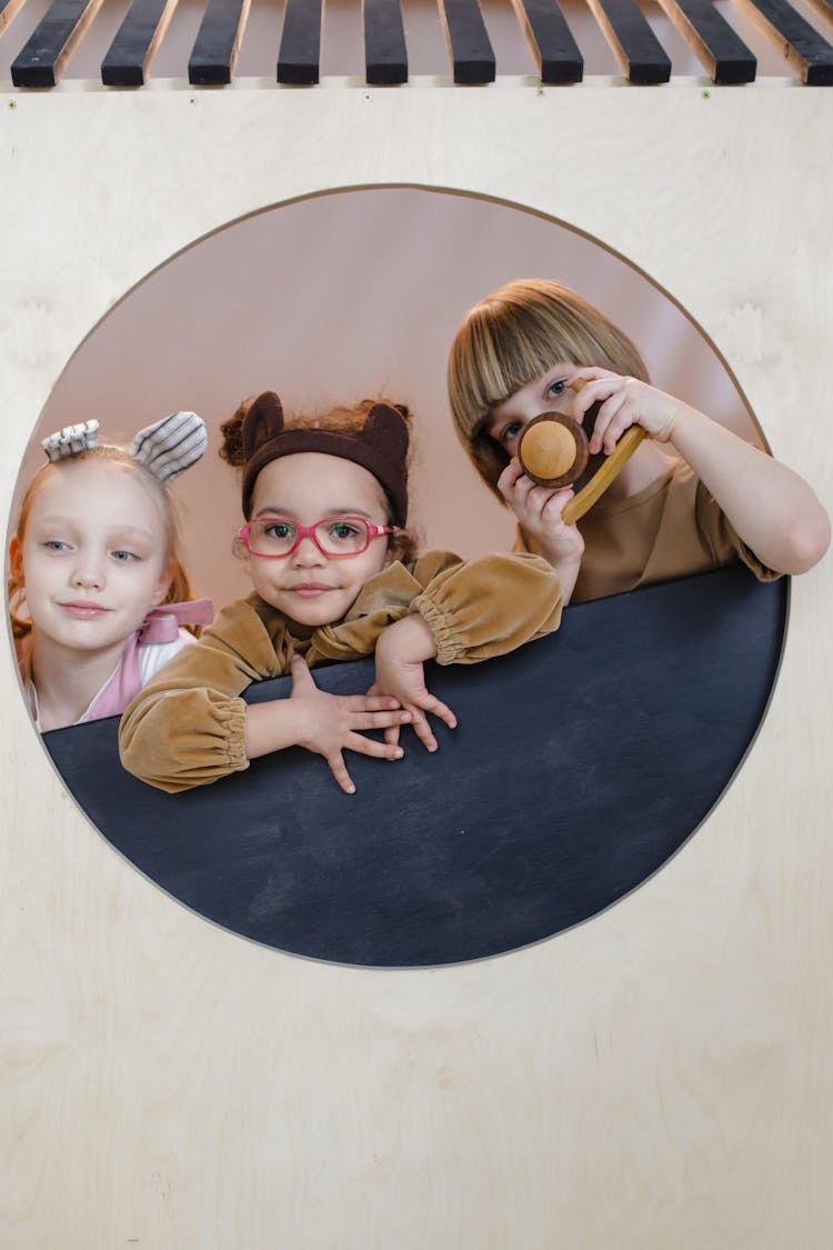 Children Playing In A Playhouse