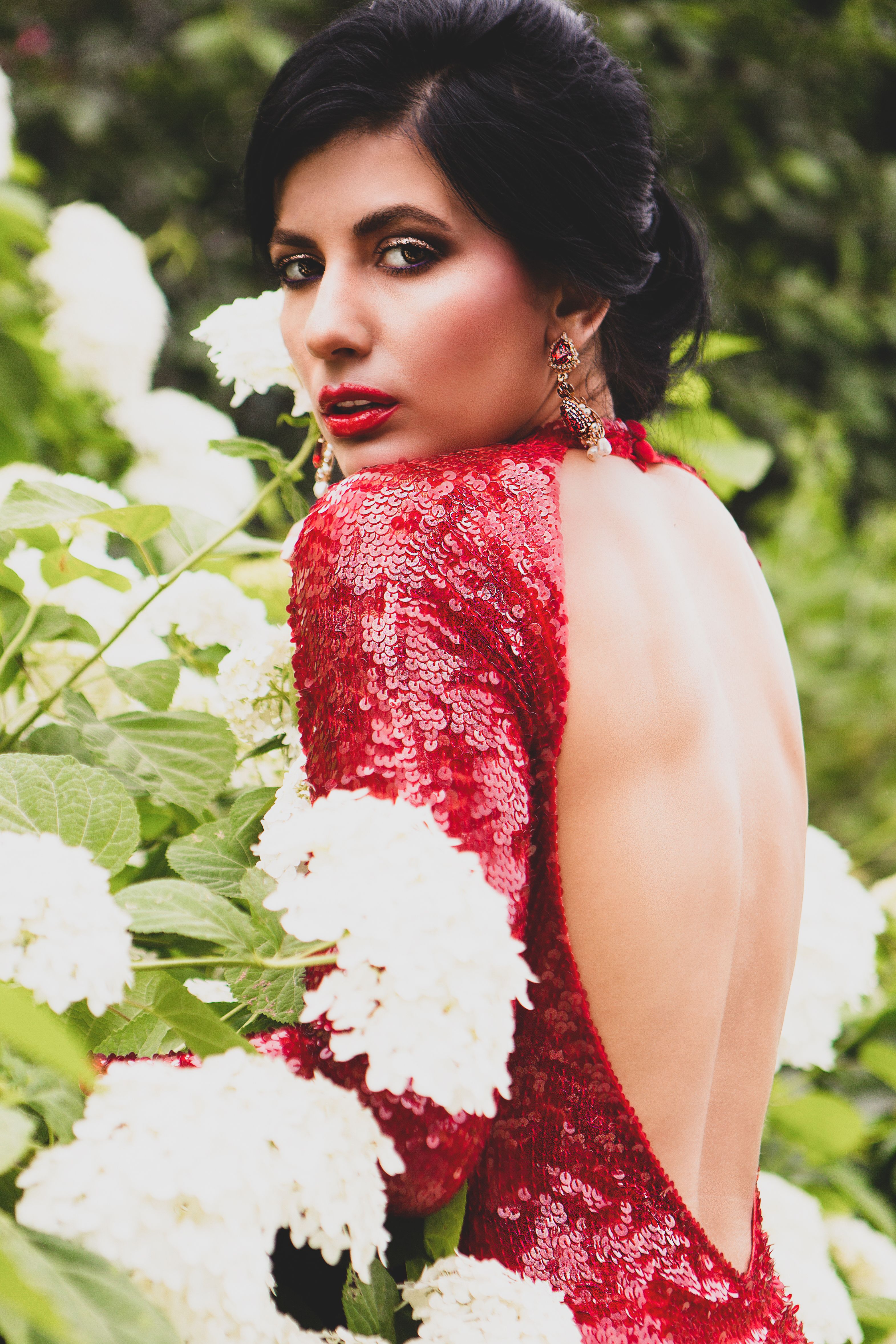 A Gorgeous Woman Wearing a Red Backless Dress · Free Stock Photo