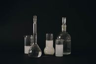 Three Clear Glass Bottles With White Background