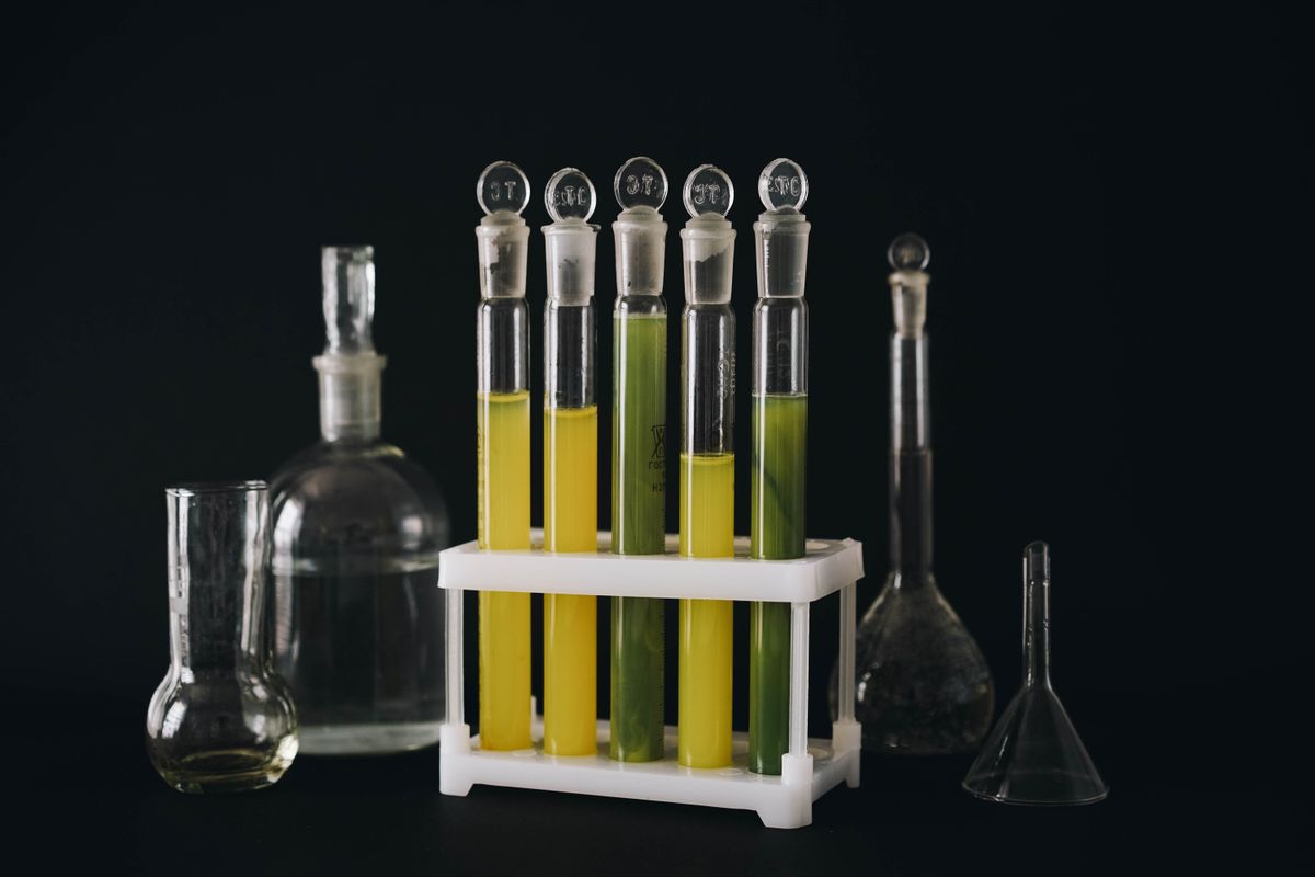 Laboratory test tubes containing liquids, representing preclinical cannabinoid research