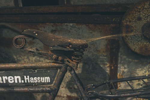 A Broken and Rusty Bicycle In Close Up View