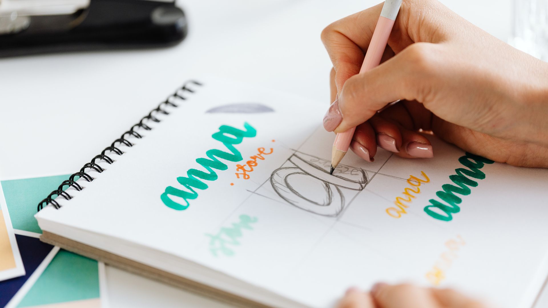 Letter Pads: Your Essential Stationery Companion 7 Close-up of a woman hand lettering colorful text in a notebook — letter pads