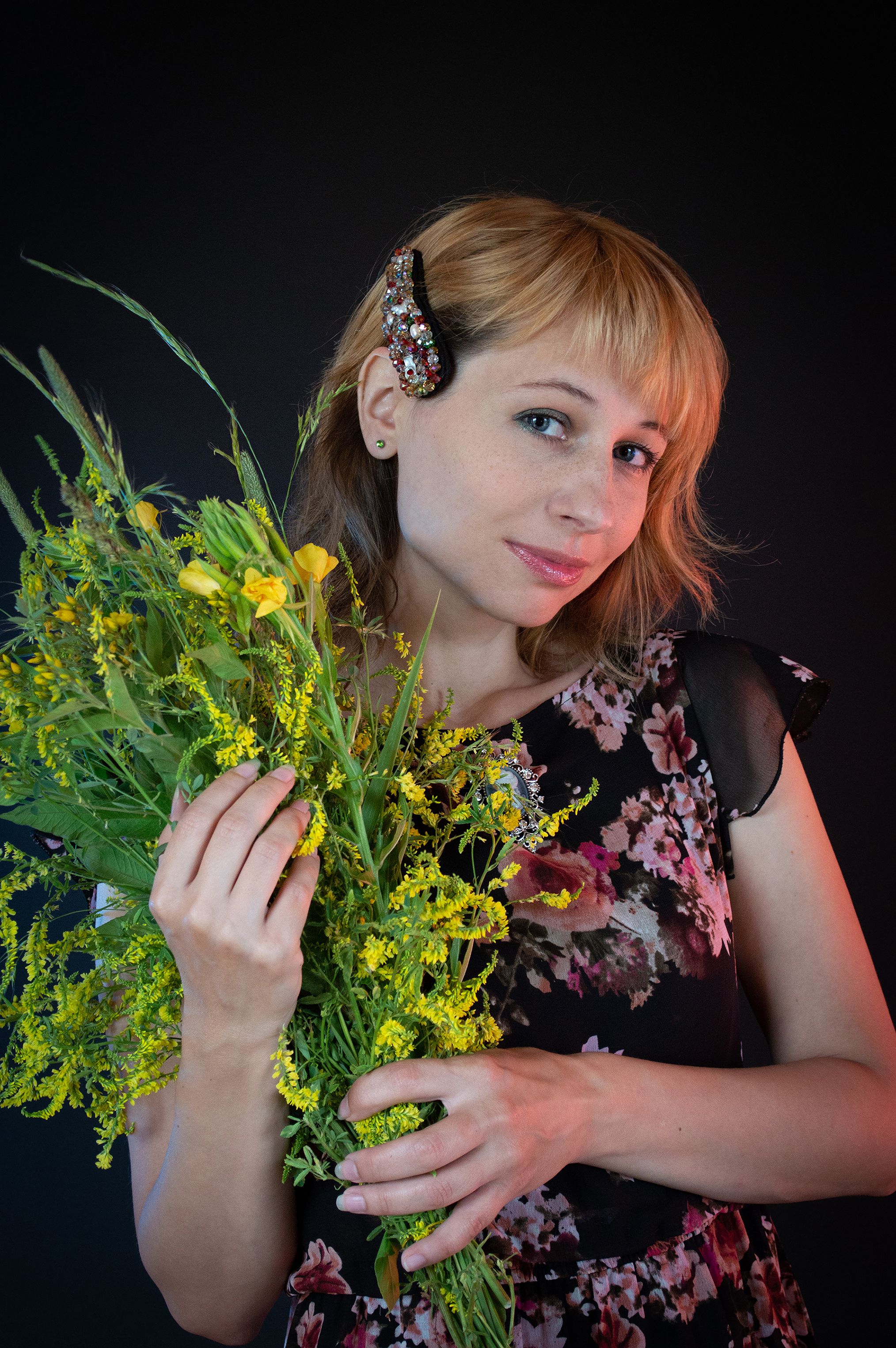 A Woman in a Floral Top Holding a Bouquet of Flowers · Free Stock Photo