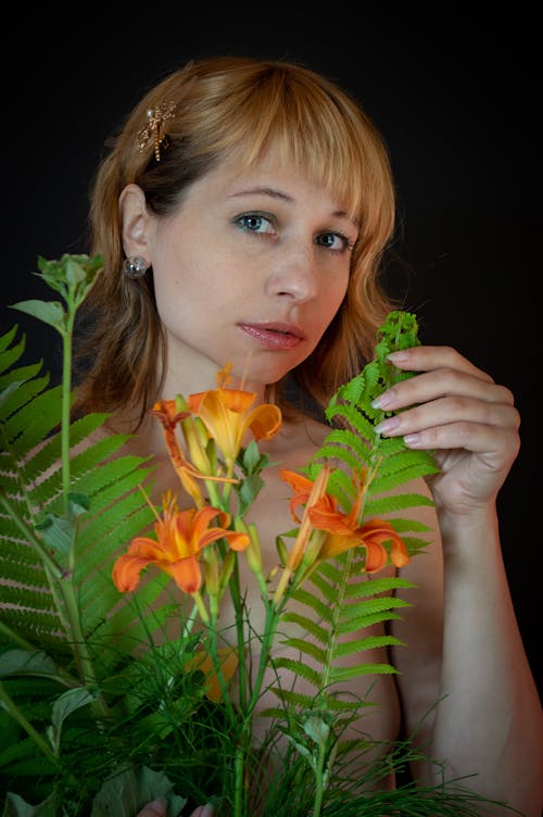 Free A Woman Holding a Bouquet of Flowers Stock Photo