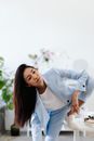 Woman in White Blazer and Blue Denim Jeans
