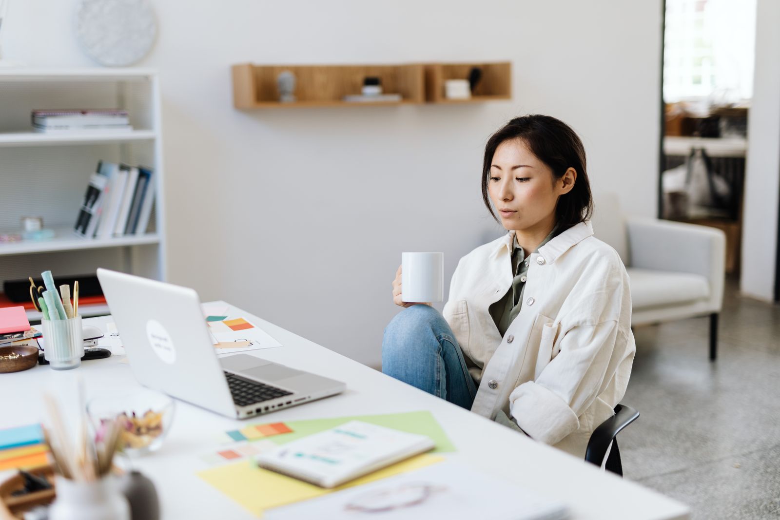 Woman working at a laptop reviewing why her freebie is not getting email sign ups
