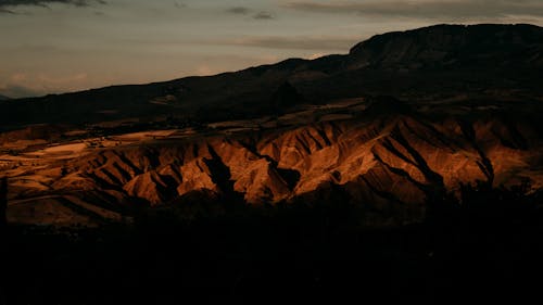 Eroded Rocks on Hills at Sunset