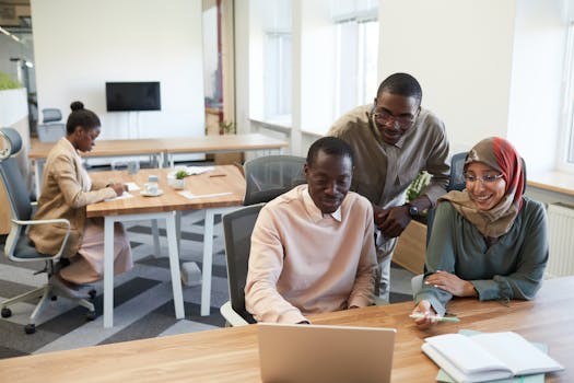A diverse group of coworkers engaged in teamwork and collaboration in a modern office setting.