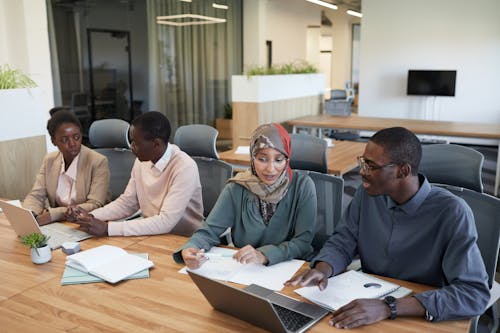 Free Group of People Sitting in an Office Stock Photo