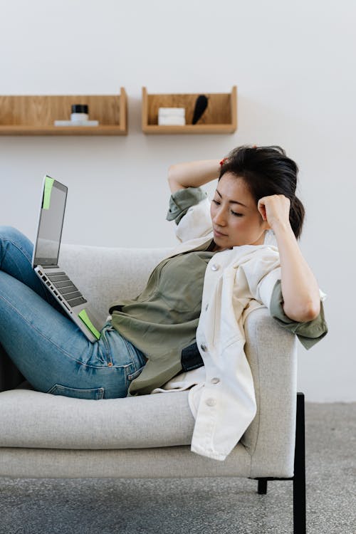 Woman Resting On An Armchair While Working