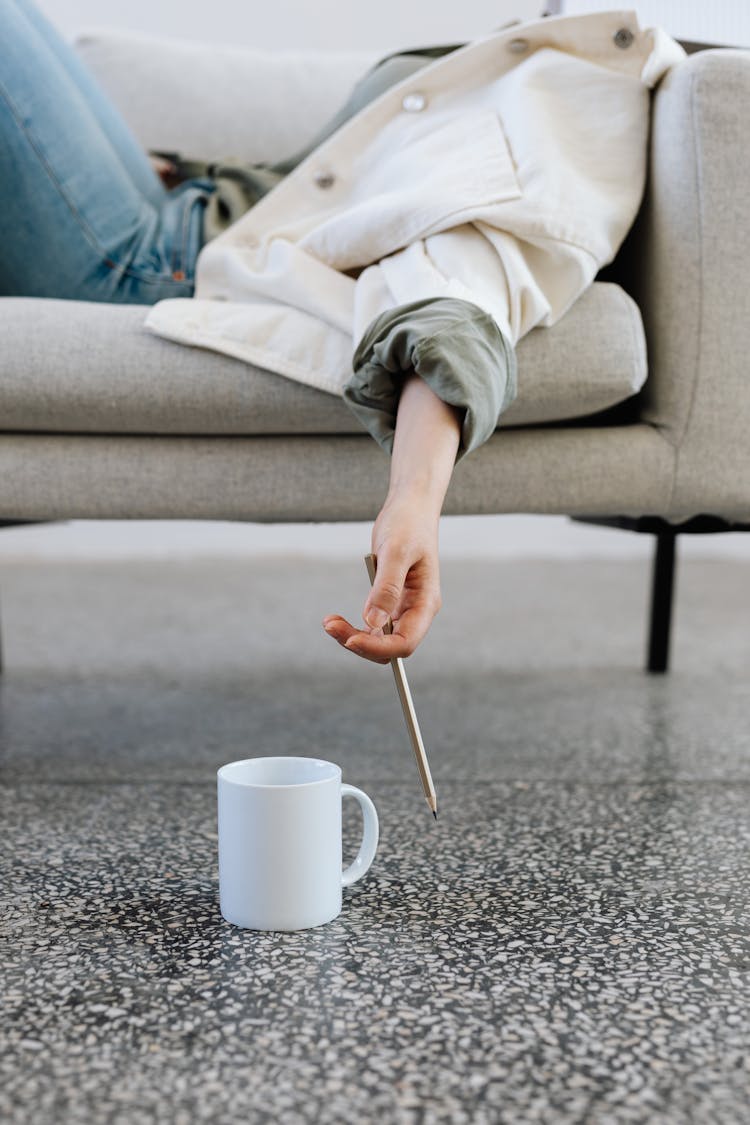 White Ceramic Mug On The Floor