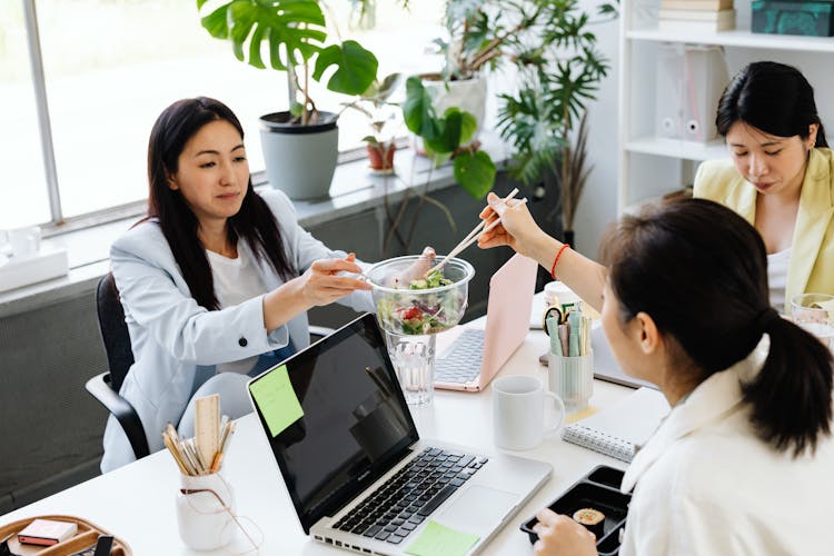 Colleagues Eating Salad In The Office