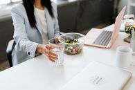 Woman in White Blazer Holding Clear Drinking Glass
