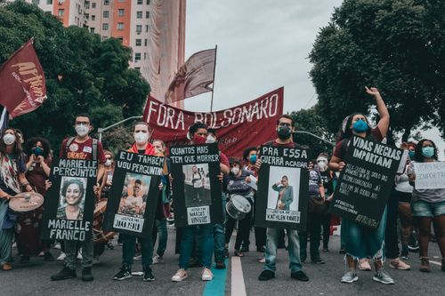 Free Protest in Rio de Janeiro with people holding banners demanding justice and equality. Stock Photo