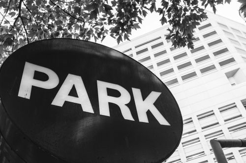 Parc Eng Sign A sign for park centre in front of trees · Free Stock Photo