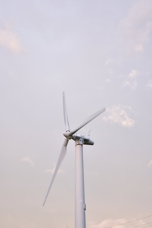 White Wind Turbine Under White Sky