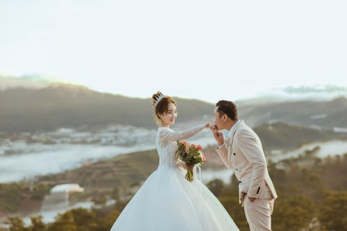 Groom Kissing the Bride's Hand