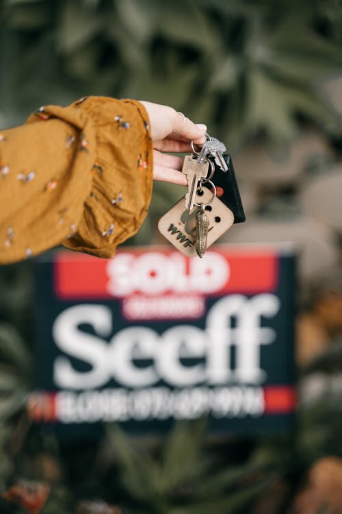 Free Person Handing Out Keys Stock Photo
