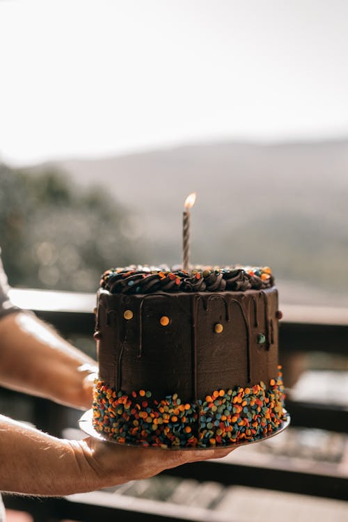 Free Close Up Photo of a Person Holding Cake Stock Photo