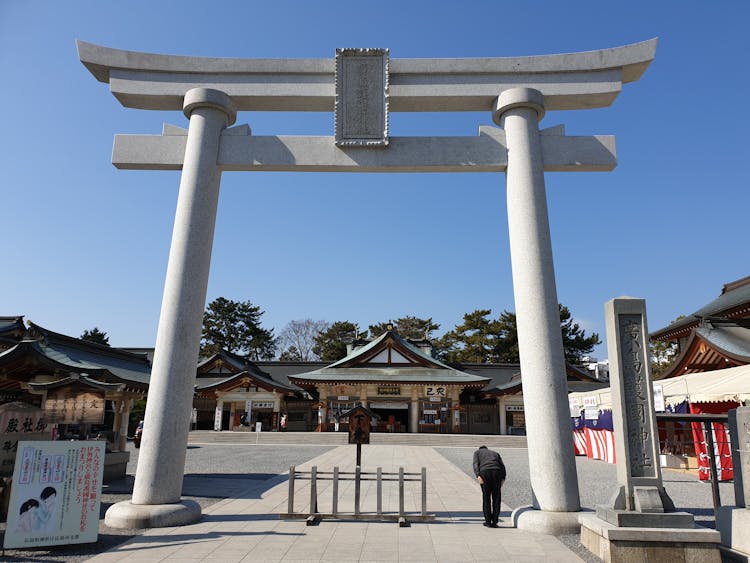 Man Bowing Down On Hiroshima Gokoku Shrine