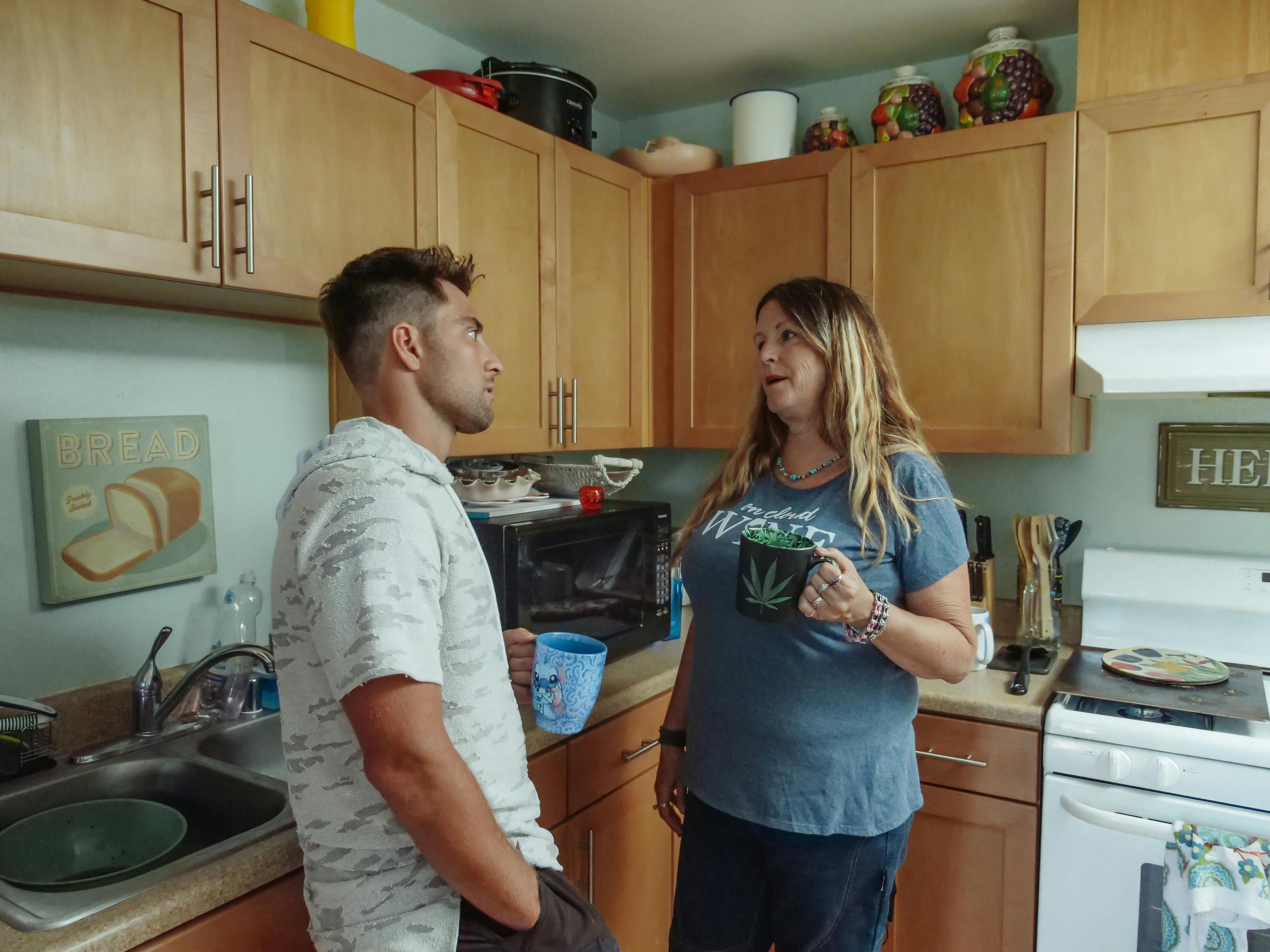 mother and son having coffee