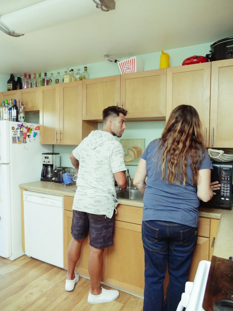 Mother And Son Doing House Chores