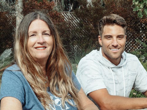 Mother and Son Sitting Side By Side