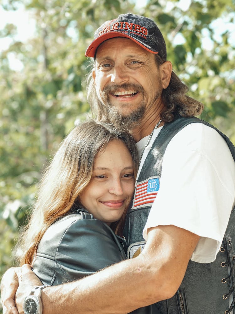 Man Hugging Her Daughter