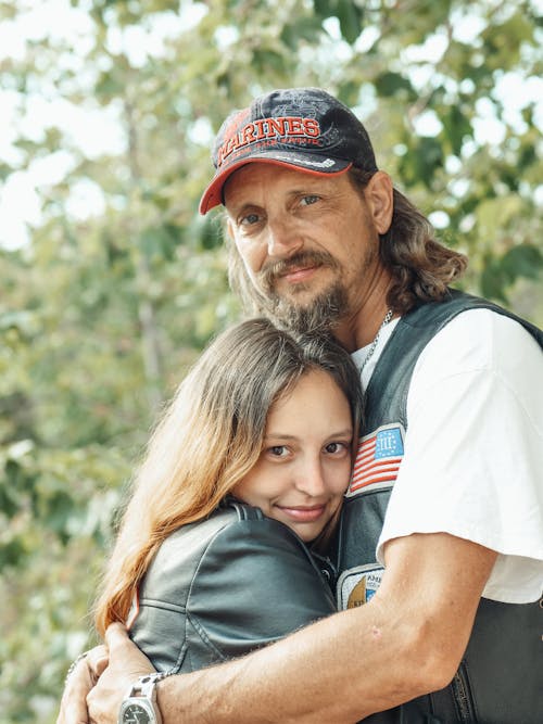 A Man Hugging His Daughter