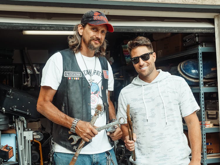 A Father With His Son Holding Hand Tools