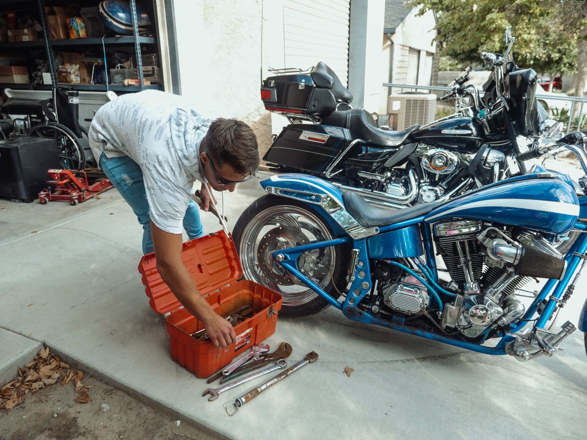 Motorcycle parked in garage during spring maintenance prep before riding season