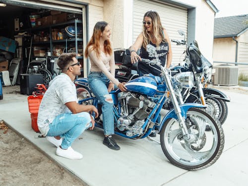 Woman Sitting on a Parked Motorcycle