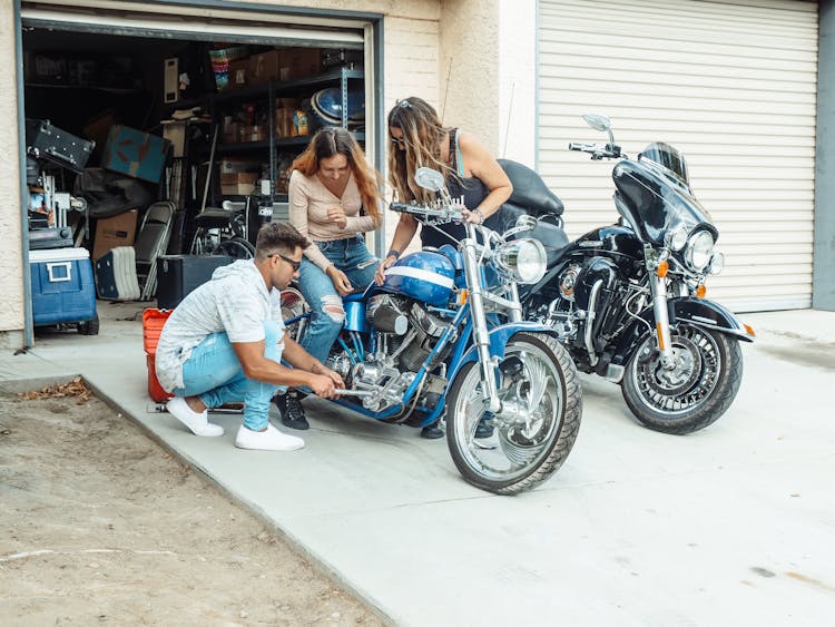 Man Fixing A Motorcycle