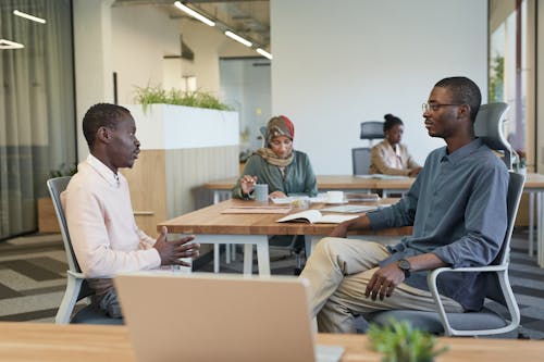 Men Having a Discussion at the Office