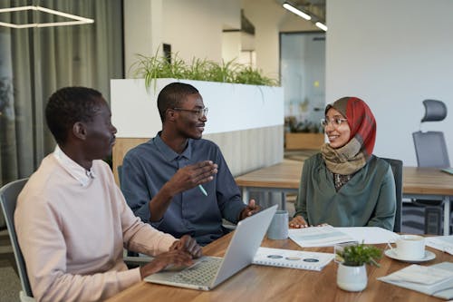 Free Men and Woman Having a Meeting at the Office Stock Photo