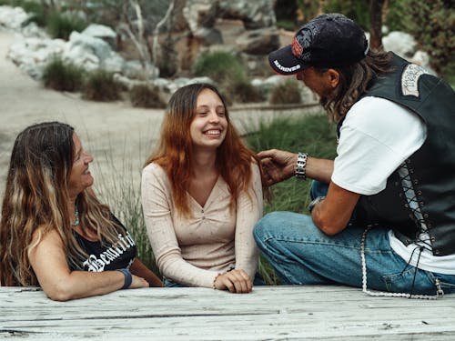 A Woman Sitting with Her Parents 