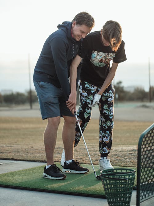 Free A Father and Son Playing Golf Stock Photo