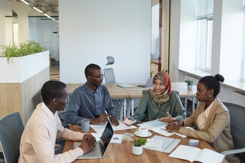 Free A diverse group of professionals engaging in a productive meeting in a contemporary office space. Stock Photo