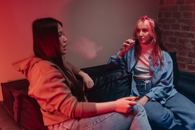 Women Smoking At A Party 